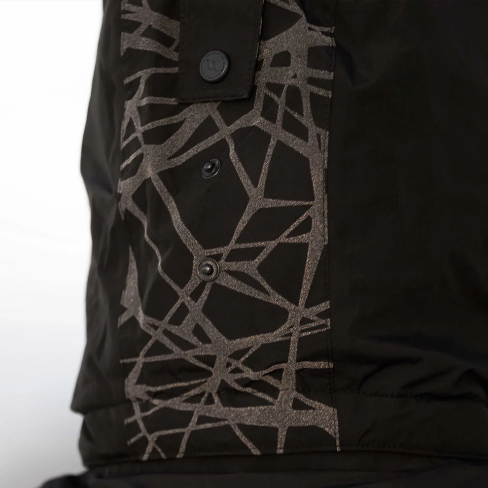 Back on Track OUTTRAKK Reflektierender Damen-Mantel ,schwarz